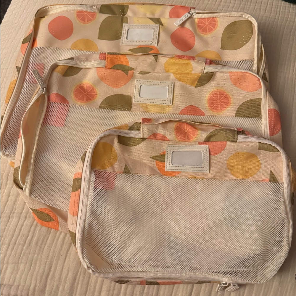Calpak Travel Bags in Cream with Citrus Print
